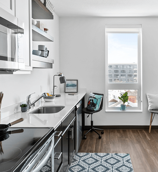 the exterior of the building from the back with the parking lot.