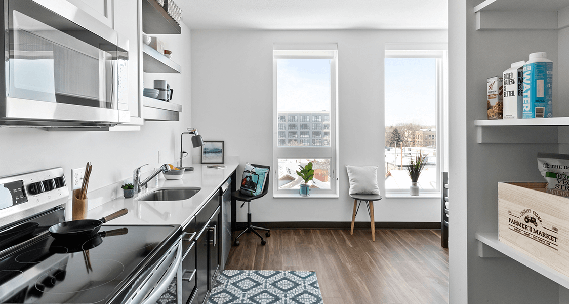 the exterior of the building from the back with the parking lot.